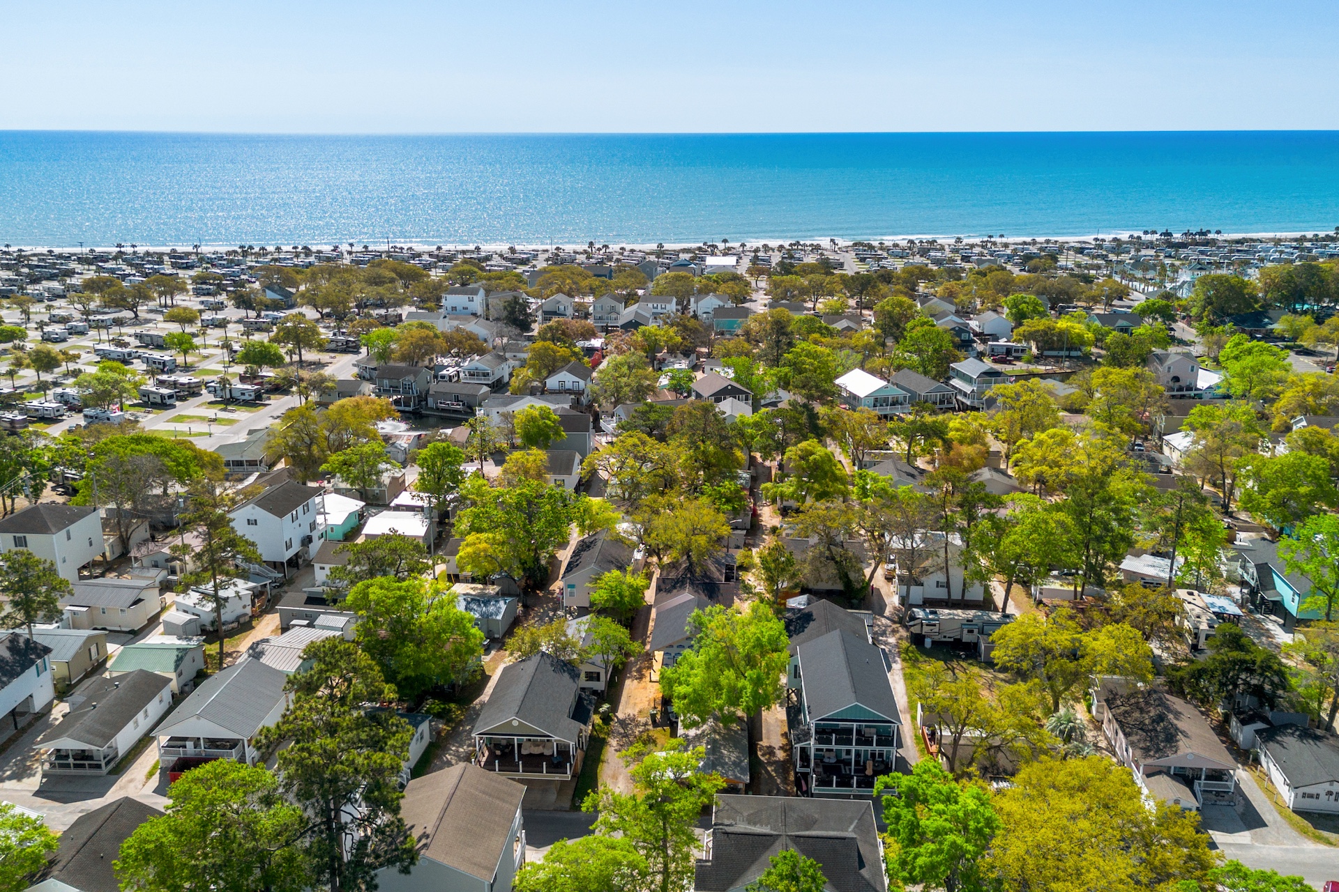Ocean Lakes Family Campground aerial view showing beach houses, RV sites and oceanfront